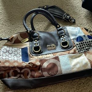 Never worn coach bag with extra strap to turn into cross body